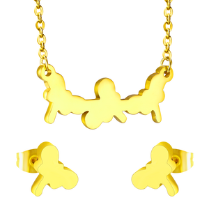 Jewelry set in gold/steel with smooth surfaces and irregular cuts