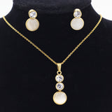 Gold/steel color sticking cat's eye stones + two small round cakes topped with diamonds jewelry set