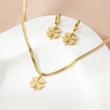 Stylish gold - toned four - leaf clover necklace and earring ensemble, available for personalization.