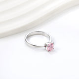 Smooth four prong band & round Pink diamond ring