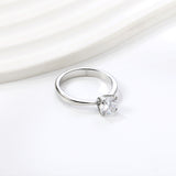 Smooth four prong band & round white diamond ring