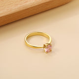 Smooth four prong band & round Pink diamond ring