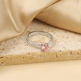 Smooth four prong band & round Pink diamond ring