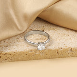 Smooth four prong band & round white diamond ring