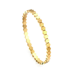 Hard bracelet with diamonds strung together with small gold-colored discs