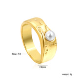 Gold-colored ring with a pearl surface