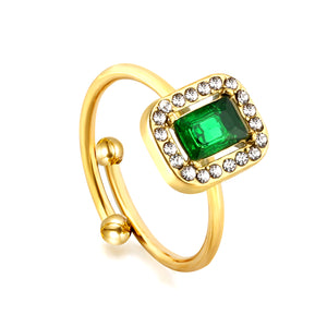 Baguette green diamond with small white diamonds ending in an open round bead ring