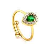 Teardrop green diamond with small white diamonds ending in an open round bead ring