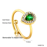 Teardrop green diamond with small white diamonds ending in an open round bead ring