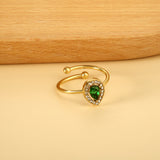 Teardrop green diamond with small white diamonds ending in an open round bead ring