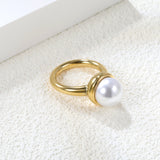 Minimalist band ring with oversized white round pearls.