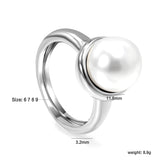 Minimalist band ring with oversized white round pearls.