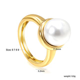 Minimalist band ring with oversized white round pearls.