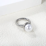 Minimalist band ring with oversized white round pearls.