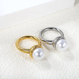 Minimalist band ring with oversized white round pearls.