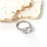 Oversized white oval diamonds on a threaded band ring.