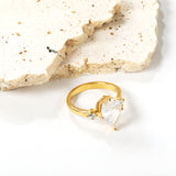 Set with a large teardrop diamond and two small diamond rings