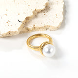 Minimalist band ring with oversized white round pearls.