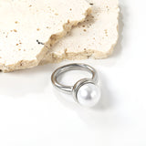 Minimalist band ring with oversized white round pearls.