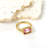 Oversized pink diamonds on a threaded band ring.