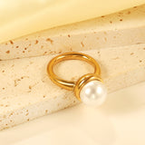 Minimalist band ring with oversized white round pearls.