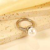 Minimalist band ring with oversized white round pearls.