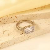 Oversized white diamonds on a threaded band ring.