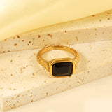 Oversized black diamonds on a threaded band ring.