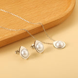 Teardrop shaped jewelry set with half white pearl steel color / gold