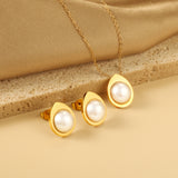 Teardrop shaped jewelry set with half white pearl steel color / gold