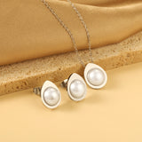 Teardrop shaped jewelry set with half white pearl steel color / gold