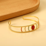 Bracelet with red stone surface in openwork hollow setting