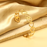 Bracelet with multiple openings in the shape of hollowed-out hearts linked together.