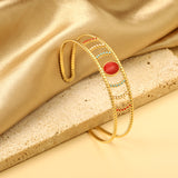 Bracelet with red stone surface in openwork hollow setting