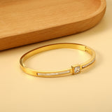 Bracelet combining two rectangular shells & diamond-set surfaces