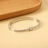 Bracelet combining two rectangular shells & diamond-set surfaces