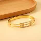 Hard bracelet with three small diamond-set bars