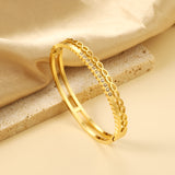 Gold-colored double stranded bracelet with diamonds