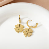 Stylish gold - toned four - leaf clover necklace and earring ensemble, available for personalization.