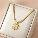 Stylish gold - toned four - leaf clover necklace and earring ensemble, available for personalization.