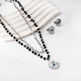 Blue eyes + black bead chain set steel/golden