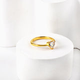 White diamond heart shaped three claw ring