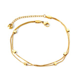 Bracelet de cheville double souple 6 petits accessoires carrés dorés 21 +5cm 