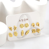 Six pairs of mixed card mounted cut-out fishbone / dolphin stud earrings gold color