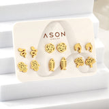 Six pairs of mixed card mounted cut-out fishbone / dolphin stud earrings gold color