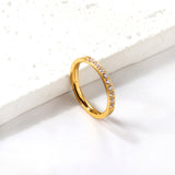 Solitaire ring with 10 small round diamonds gold/steel color