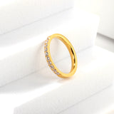 Solitaire ring with 10 small round diamonds gold/steel color