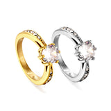 Solitaire ring with several small diamonds + one large round diamond Gold/steel color