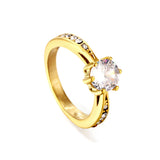 Solitaire ring with several small diamonds + one large round diamond Gold/steel color