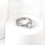 Solitaire ring with several small diamonds + one large round diamond Gold/steel color